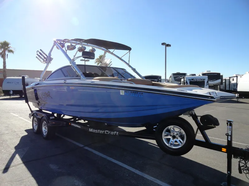 Slide: The Image of 2007 MasterCraft X-Star boat on trailer in parking lot. - 4