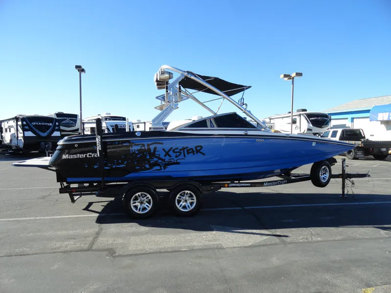 Slide: The Image of 2007 MasterCraft X-Star boat on trailer in parking lot. - 5