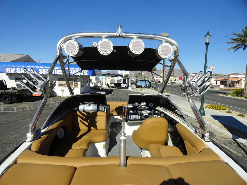 Slide: The Image of 2007 MasterCraft X-Star boat interior with tan seats and wakeboard tower. - 6