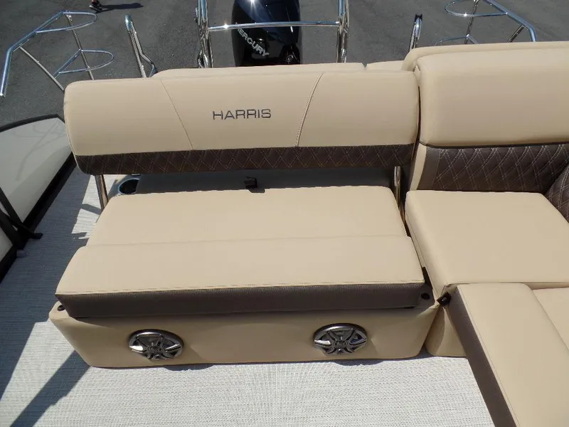 Slide: The Image of 2025 Harris Sunliner 250 boat seating with beige upholstery and integrated speakers. - 8
