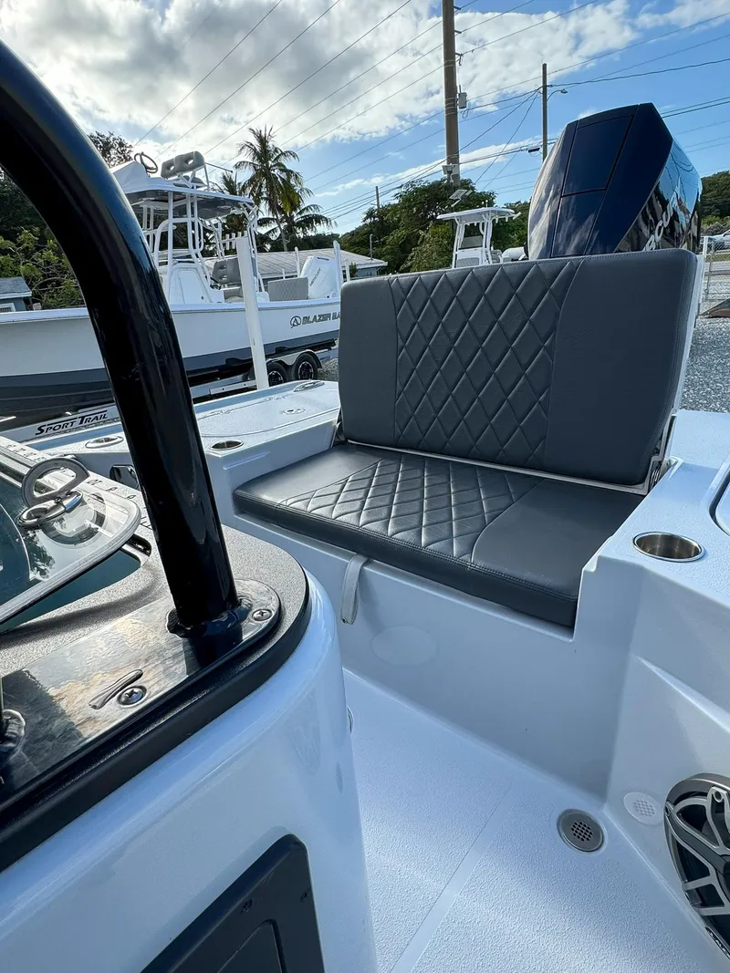 Slide: The Image of 2025 Blazer 2700 HYBRID BAY boat interior with cushioned seating and modern design. - 11