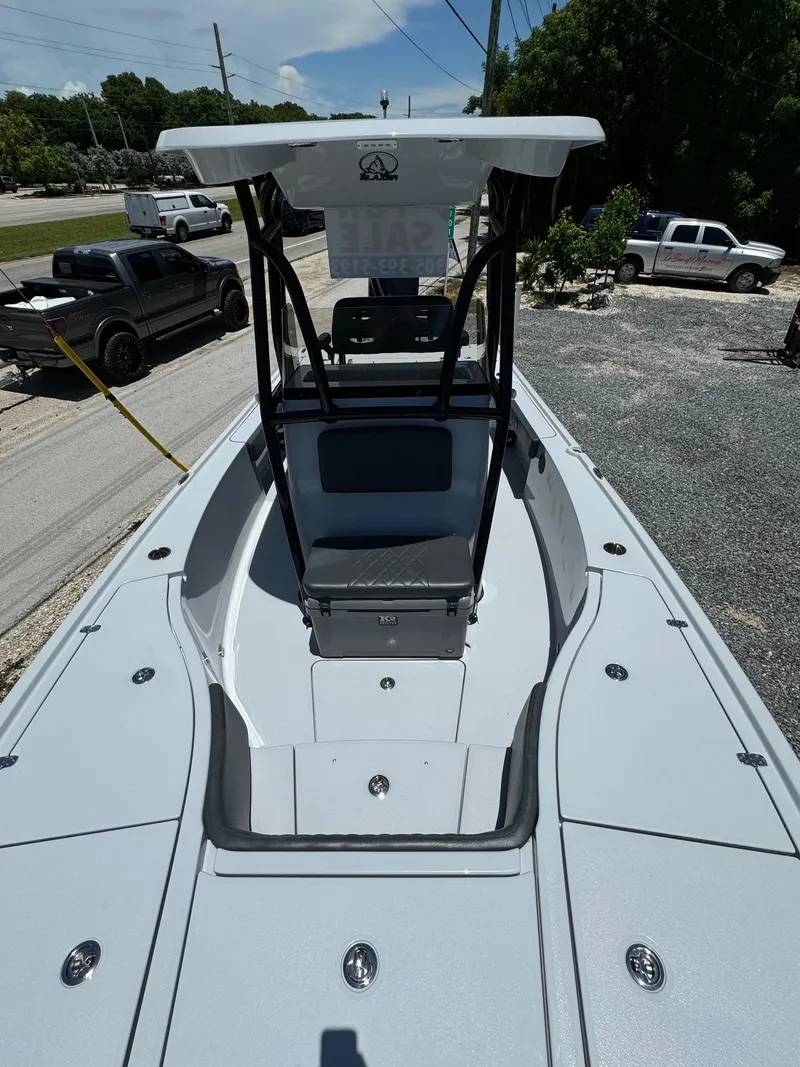 Slide: The Image of 2025 Blazer 2700 HYBRID BAY boat, front deck view with seating and storage compartments. - 5
