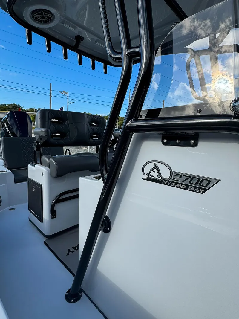 Slide: The Image of 2025 Blazer 2700 HYBRID BAY boat interior, featuring sleek design and modern seating. - 9