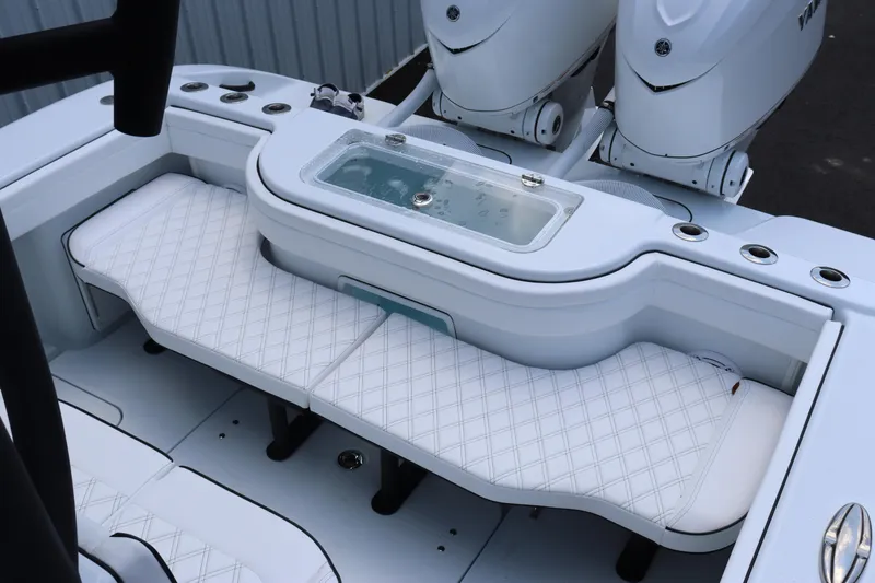 Slide: The Image of 2025 Yellowfin 32 Offshore boat with cushioned seating and dual outboard motors. - 10