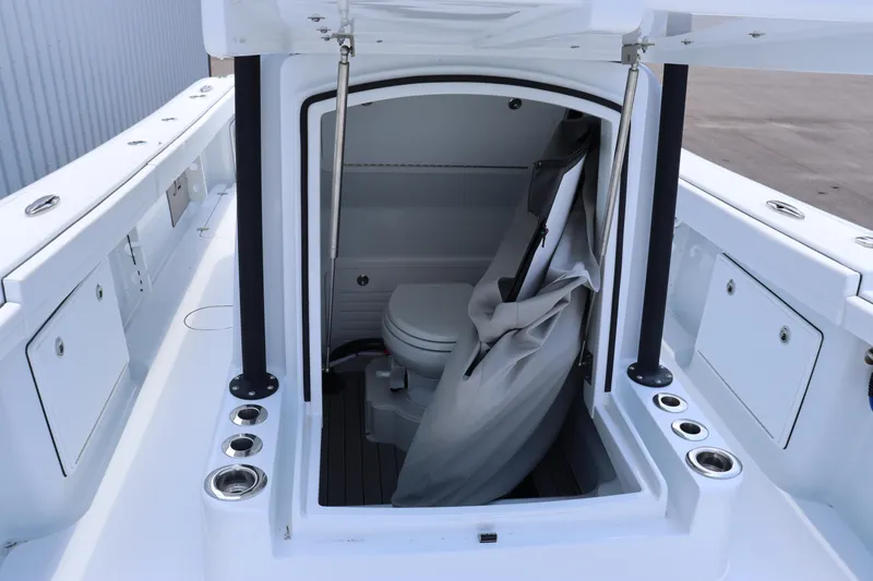 Slide: The Image of 2025 Yellowfin 32 Offshore boat with open console and marine toilet. - 18