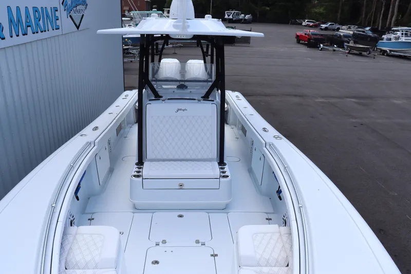 Slide: The Image of 2025 Yellowfin 32 Offshore boat with white seating and spacious deck. - 6