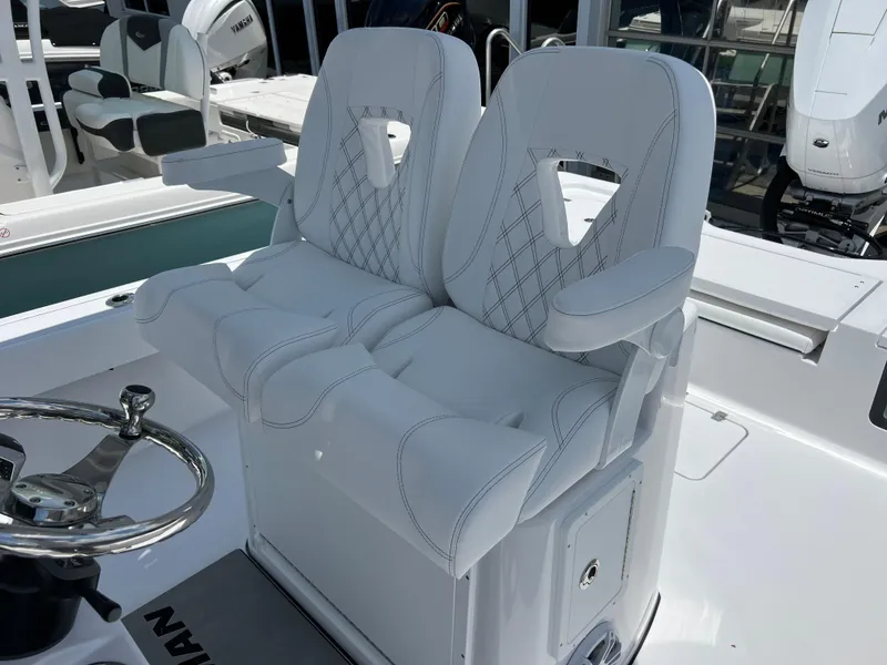Slide: The Image of 2024 Sportsman Masters 267OE Bay Boat dual captain's chairs and steering wheel. - 10