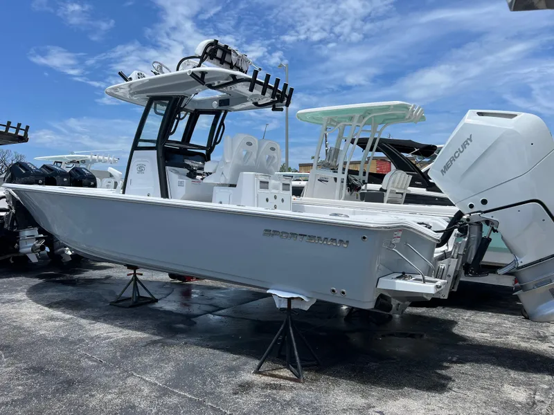 Slide: The Image of 2024 Sportsman Masters 267OE Bay Boat with Mercury engine on display. - 2