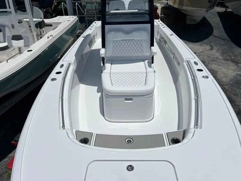 Slide: The Image of 2024 Sportsman Masters 267OE Bay Boat with white seating and spacious deck. - 9