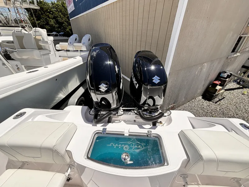 Slide: The Image of 2022 Streamline 26CC boat with twin Suzuki outboard engines. - 3