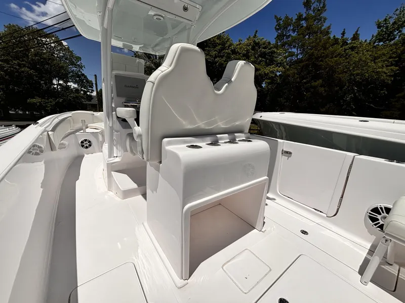 Slide: The Image of 2022 Streamline 26CC boat interior with white seating and storage compartments. - 4
