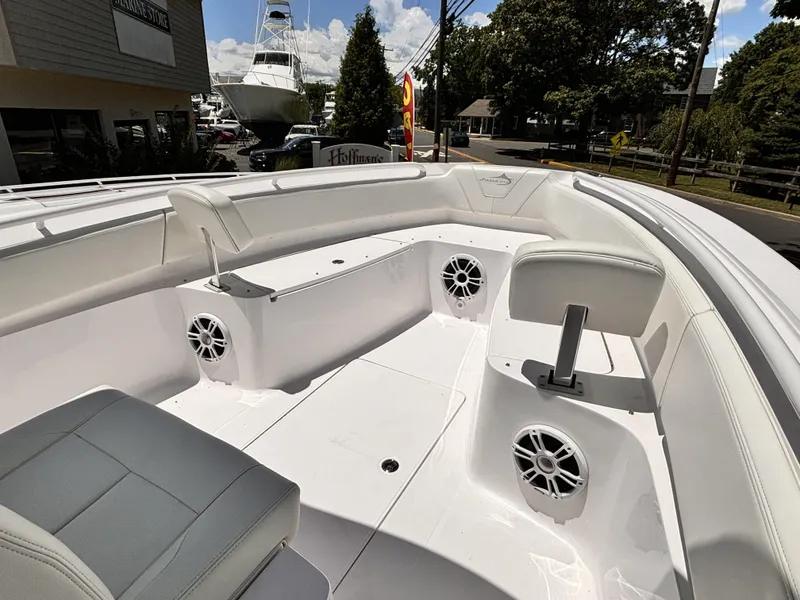 Slide: The Image of 2022 Streamline 26CC boat interior with seating and speakers. - 8