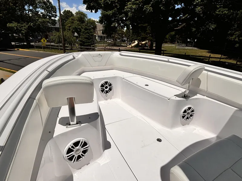 Slide: The Image of 2022 Streamline 26CC boat interior with seating and speakers. - 9