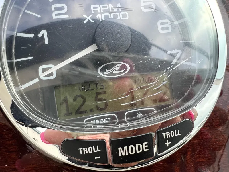 Slide: The Image of Close-up of Sea Ray 270 Sundancer 2009 boat tachometer displaying 12.5 volts and 1.1 hours. - 23