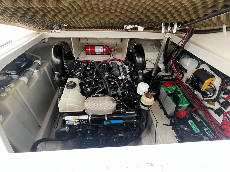 Slide: The Image of Engine compartment of a 2009 Sea Ray 270 Sundancer boat, featuring detailed components and wiring. - 25