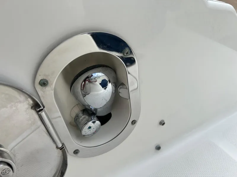 Slide: The Image of Close-up of a 2009 Sea Ray 270 Sundancer boat's chrome fuel cap. - 29