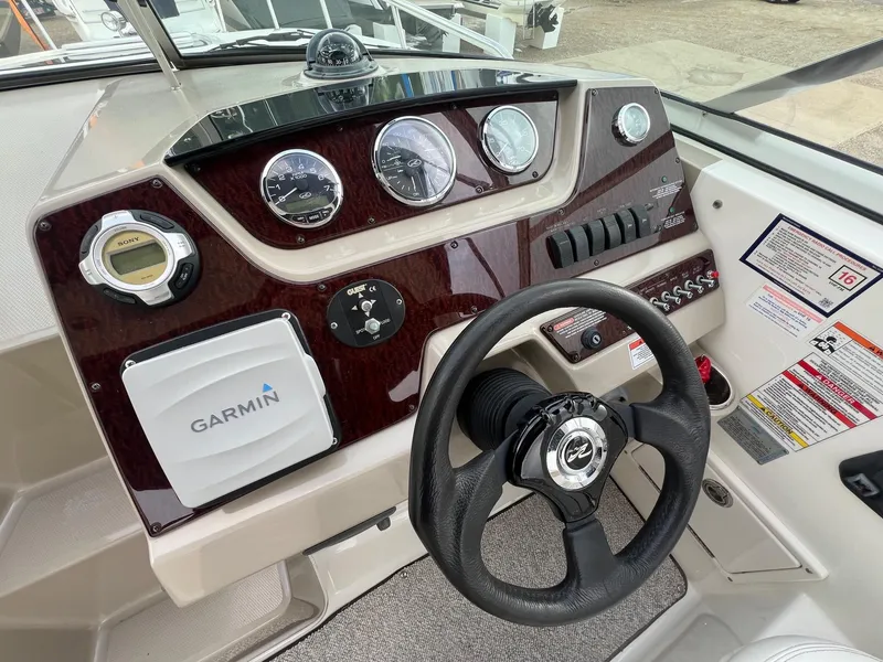 Slide: The Image of Dashboard of a 2009 Sea Ray 270 Sundancer boat with Garmin navigation system. - 7
