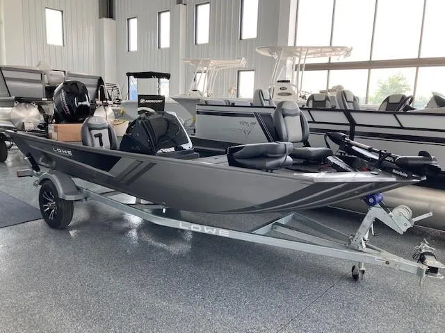 The Image of 2023 Lowe Skorpion 17 fishing boat on trailer in showroom. - 1