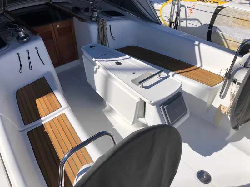 Slide: The Image of Beneteau 40 sailboat cockpit, 2008 model, featuring teak seating and modern design. - 17