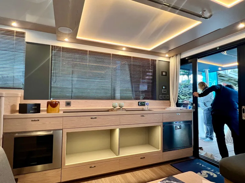 Slide: The Image of Modern interior of 2025 Beneteau Swift Trawler 54 with sleek kitchen design. - 6