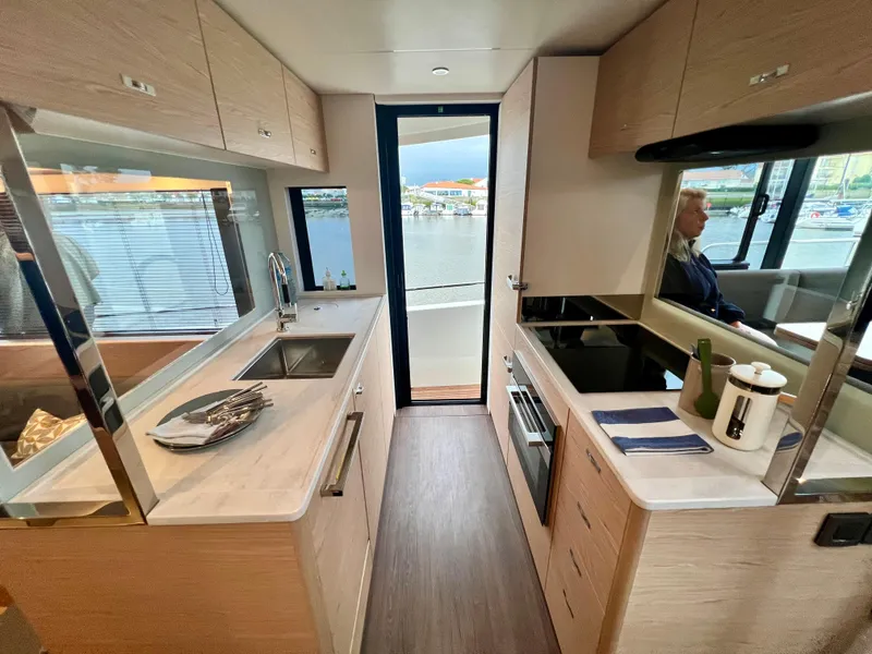 Slide: The Image of Modern kitchen interior of 2025 Beneteau Swift Trawler 54 yacht. - 9