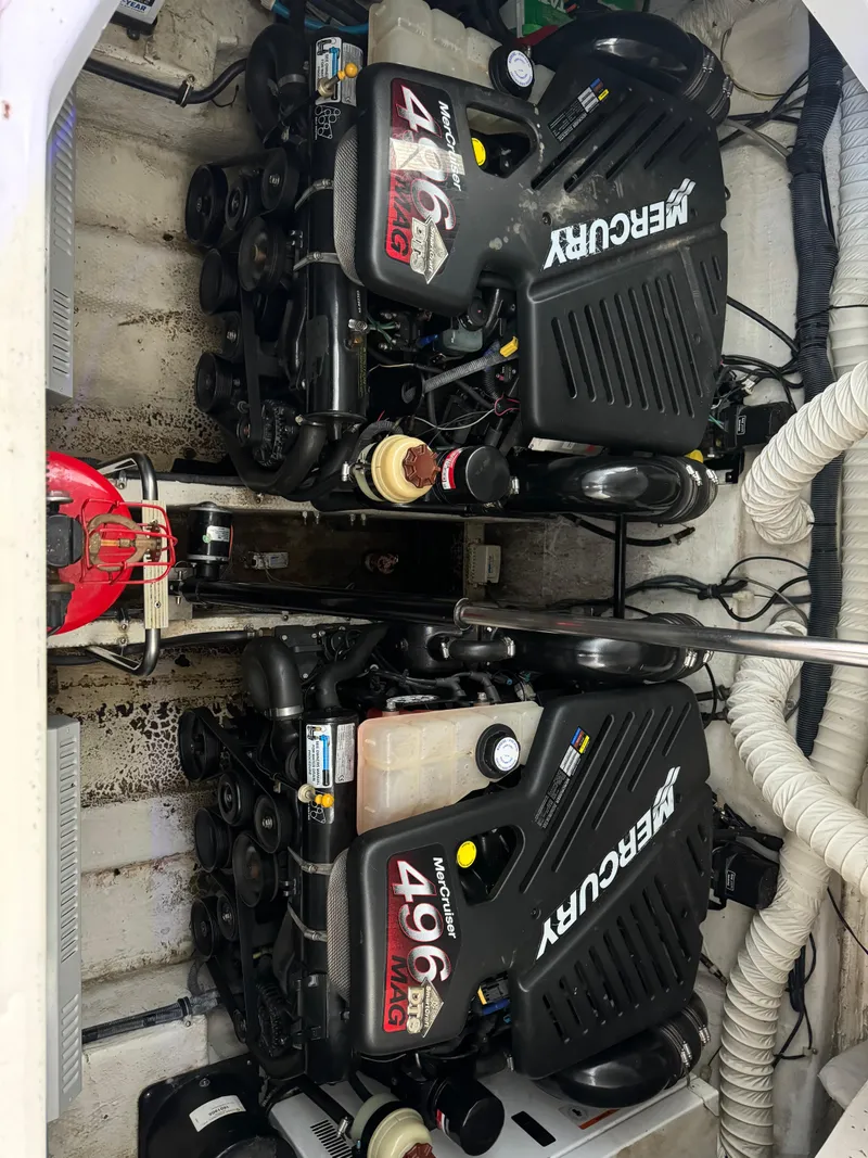 Slide: The Image of 2008 Rinker 370 boat engine compartment with dual Mercury 496 engines. - 12