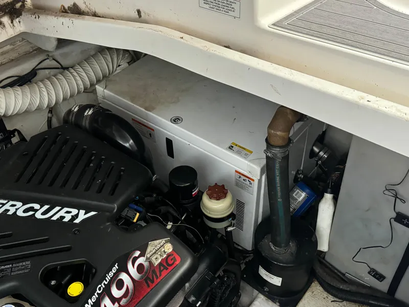 Slide: The Image of Engine compartment of 2008 Rinker 370 boat with Mercury 496 MAG engine. - 13