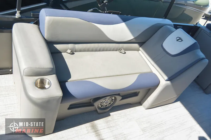Slide: The Image of 2023 Tahoe Pontoon LTZ Elite boat seating with cup holder and speaker. - 12