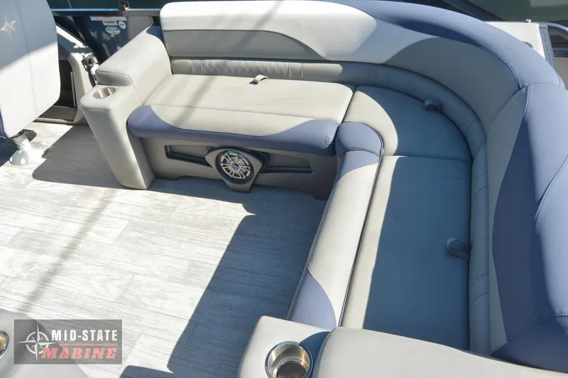 Slide: The Image of 2023 Tahoe Pontoon LTZ Elite interior with plush seating and built-in speaker. - 14