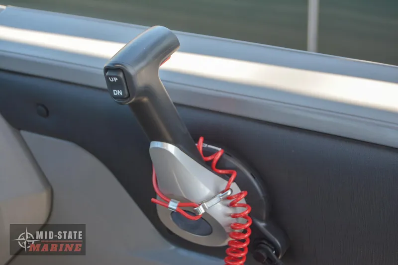 Slide: The Image of 2023 Tahoe Pontoon LTZ Elite throttle control lever with red safety lanyard. - 23