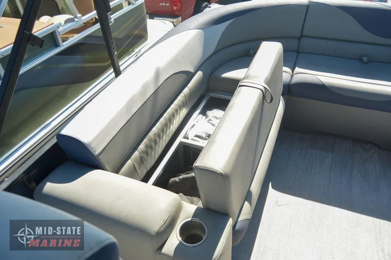 Slide: The Image of 2023 Tahoe Pontoon LTZ Elite interior with seating and storage compartments. - 24