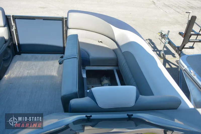 Slide: The Image of 2023 Tahoe Pontoon LTZ Elite interior with spacious seating and storage. - 27