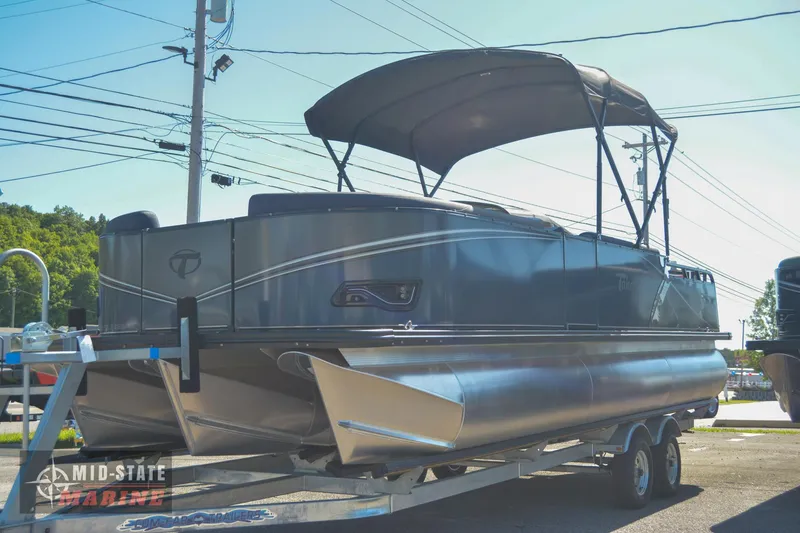 Slide: The Image of 2023 Tahoe Pontoon LTZ Elite on trailer with canopy. - 3