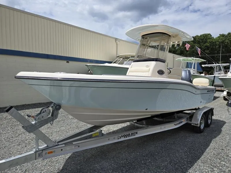 The Image of 2025 Grady-White 231 CE boat on a Load Rite trailer in a marina. - 0