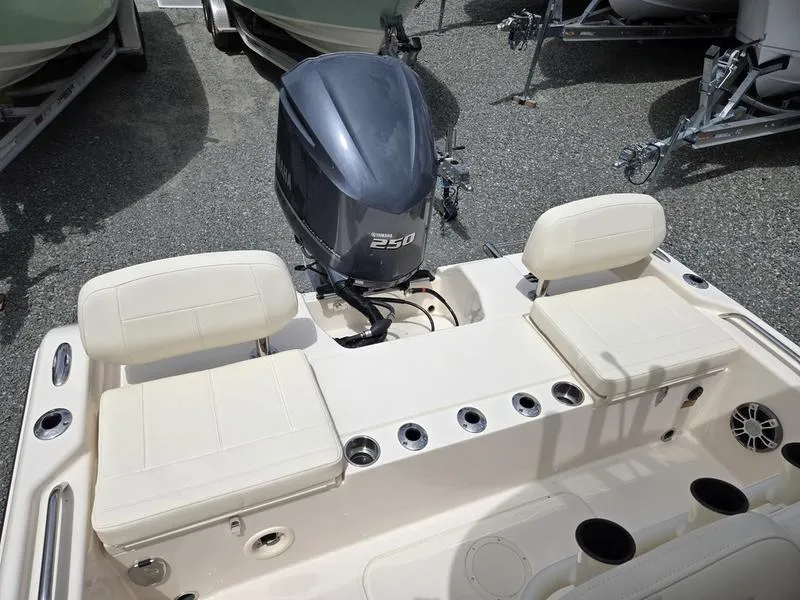 Slide: The Image of 2025 Grady-White 231 CE boat with Yamaha 250 outboard motor and cushioned seating. - 11