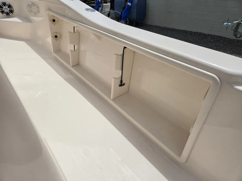 Slide: The Image of 2025 Grady-White 231 CE boat storage compartment with built-in speakers. - 13