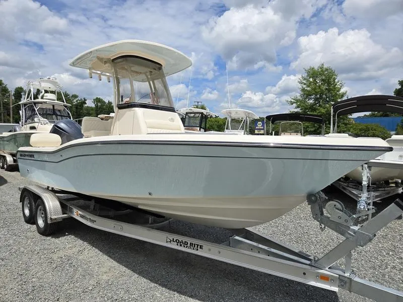 Slide: The Image of 2025 Grady-White 231 CE boat on Load Rite trailer, parked outdoors. - 17