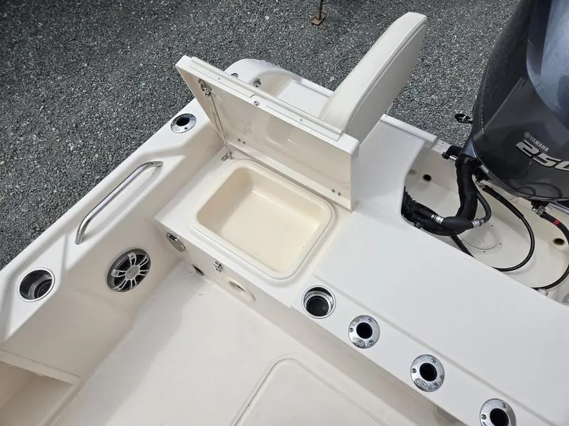 Slide: The Image of 2025 Grady-White 231 CE boat with open storage compartment and seating. - 18