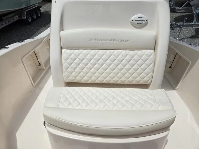 Slide: The Image of 2025 Grady-White 231 CE boat with white cushioned seating. - 19