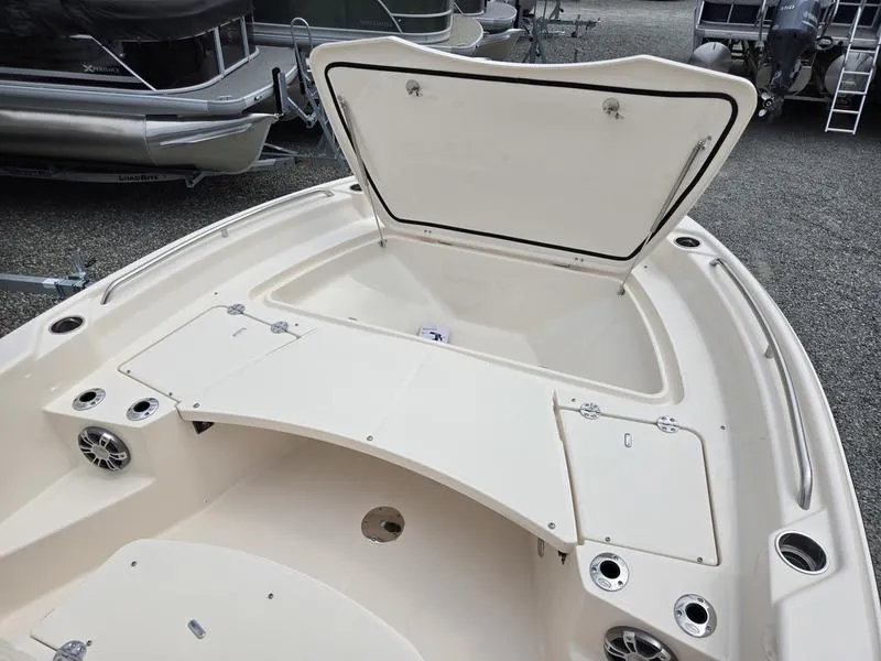 Slide: The Image of 2025 Grady-White 231 CE boat with open storage compartment and seating area. - 2