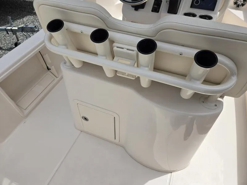 Slide: The Image of Grady-White 231 CE 2025 boat interior with rod holders and storage compartment. - 23