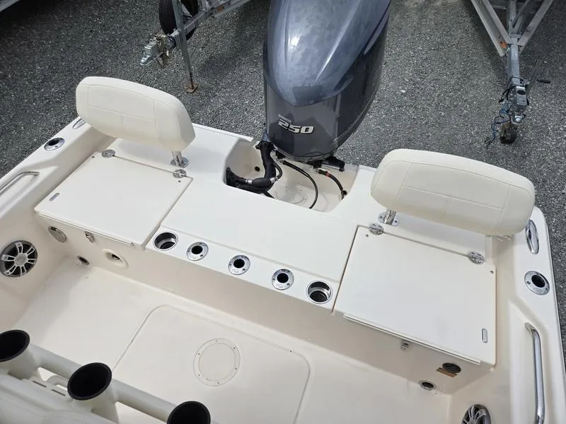 Slide: The Image of 2025 Grady-White 231 CE boat stern with seating and outboard motor. - 24