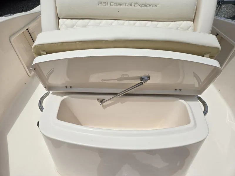 Slide: The Image of 2025 Grady-White 231 CE boat storage compartment with open lid. - 25