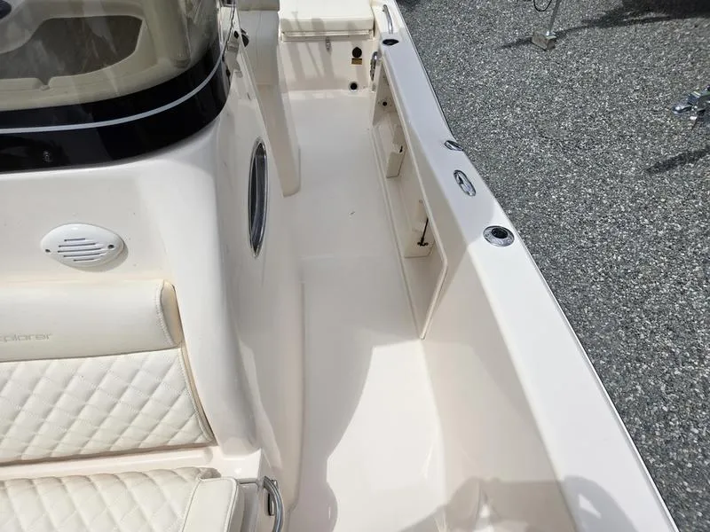 Slide: The Image of 2025 Grady-White 231 CE boat interior, white seating, and clean deck. - 8