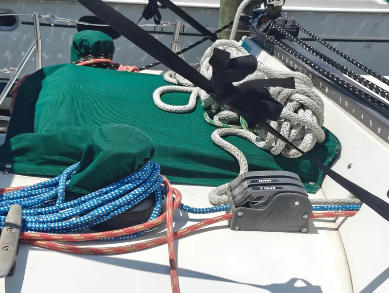 Slide: The Image of Deck of 1987 Newport MKII sailboat with ropes and winch system. - 11