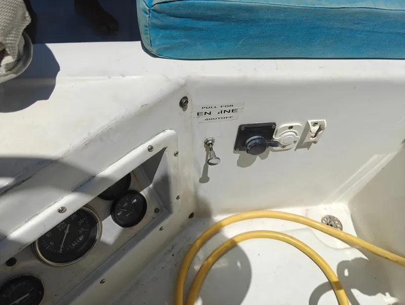 Slide: The Image of Control panel of a 1987 Newport MKII boat with gauges and switches. - 15