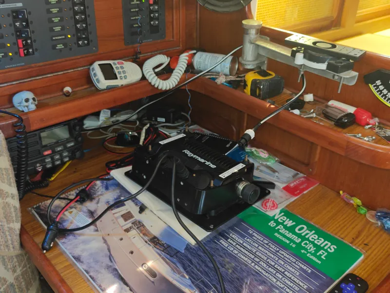 Slide: The Image of Boat navigation equipment on Newport MKII, 1987 model, with control panels and communication devices. - 46