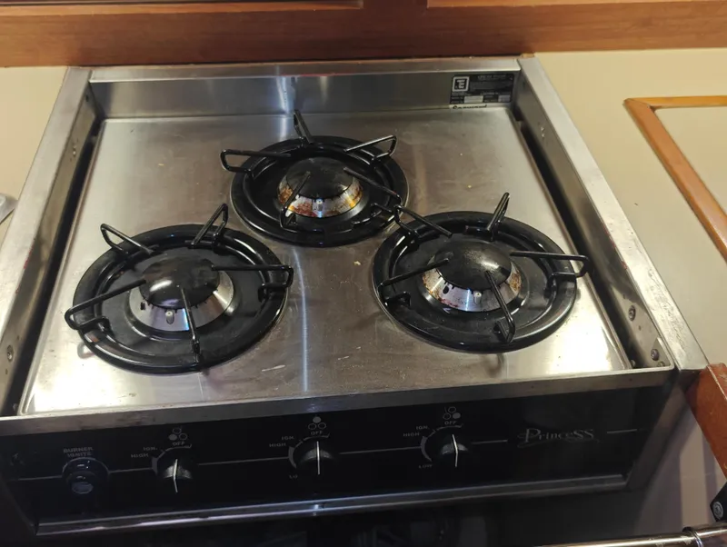 Slide: The Image of Three-burner Newport MKII stove from 1987 with stainless steel surface. - 48