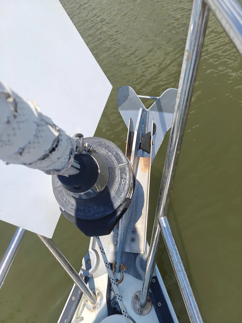 Slide: The Image of Bow of 1987 Newport MKII sailboat with anchor and furler system. - 6