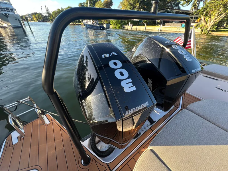 Slide: The Image of 2023 Axopar 37 Sun-Top with twin Mercury 300 V8 engines on the water. - 12